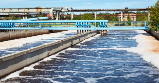 Aerated industrial wastewater treatment basins with blue pipework